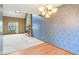 Living room featuring a stone fireplace and adjacent sunroom space at 2430 Spring Hill Ct, Indianapolis, IN 46268