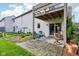 Concrete patio with furniture below wood deck and stairs at 2430 Spring Hill Ct, Indianapolis, IN 46268