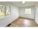 Well lit bedroom with new wood floors, fresh paint and two windows at 2431 Timbercrest Dr, Columbus, IN 47203