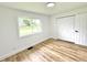 Bedroom featuring wood floors, white walls, and double door closet at 2431 Timbercrest Dr, Columbus, IN 47203