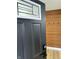 Entryway with a coat rack on a modern accent wall, with natural-looking light-toned floors at 2431 Timbercrest Dr, Columbus, IN 47203