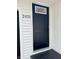 Modern front door, painted black, with the house number, 2431, visible on the exterior brick at 2431 Timbercrest Dr, Columbus, IN 47203