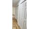 Hallway with new floors and fresh paint, with multiple closets for storage at 2431 Timbercrest Dr, Columbus, IN 47203