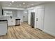 Bright kitchen boasts stainless steel appliances, granite countertops, and luxury vinyl plank flooring at 2431 Timbercrest Dr, Columbus, IN 47203