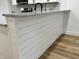 Kitchen island features white siding and a sleek granite countertop at 2431 Timbercrest Dr, Columbus, IN 47203