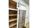 Spacious pantry and stainless steel refrigerator maximize storage in the kitchen at 2431 Timbercrest Dr, Columbus, IN 47203