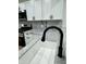 Modern kitchen features black fixtures and stainless steel appliances at 2431 Timbercrest Dr, Columbus, IN 47203