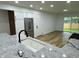 Bright kitchen features granite countertops, stainless steel appliances and sliding glass door to the backyard at 2431 Timbercrest Dr, Columbus, IN 47203