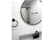 Close up of bathroom featuring black round mirror and white vanity at 2431 Timbercrest Dr, Columbus, IN 47203