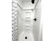 Bathroom featuring a white shower with black hardware and geometric shower curtain at 2431 Timbercrest Dr, Columbus, IN 47203