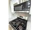 Modern gas cooktop with stainless steel microwave above at 2431 Timbercrest Dr, Columbus, IN 47203