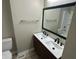 Bright bathroom featuring double sinks and a large mirror at 2453 Larnie Ln, Indianapolis, IN 46219