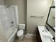 Bright bathroom featuring a double sink vanity and a shower-tub combo at 2453 Larnie Ln, Indianapolis, IN 46219