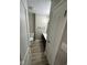 Bathroom with a single sink vanity, modern lighting, and laminate floors at 2453 Larnie Ln, Indianapolis, IN 46219