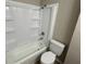 Bright bathroom featuring a shower-tub combo at 2453 Larnie Ln, Indianapolis, IN 46219
