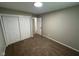 Neutral bedroom with carpet floors and large closet space providing ample storage at 2453 Larnie Ln, Indianapolis, IN 46219