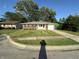 Charming single-story brick home with a well-manicured lawn and attached garage at 2453 Larnie Ln, Indianapolis, IN 46219