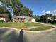 Charming single-story brick home with a well-manicured lawn and attached garage at 2453 Larnie Ln, Indianapolis, IN 46219