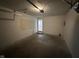 Spacious garage with white walls, a pegboard, and ample room for vehicles and storage at 2453 Larnie Ln, Indianapolis, IN 46219