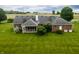 This home has a screened-in back porch and spacious yard surrounded by lush trees at 2708 N Buck Creek Rd, Greenfield, IN 46140