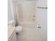 Bathroom featuring a combination shower and tub with neutral tones, optimizing space and functionality at 2708 N Buck Creek Rd, Greenfield, IN 46140