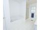 A bright bathroom with a soaking tub, separate shower, and window with shutter providing a relaxing spa-like experience at 2708 N Buck Creek Rd, Greenfield, IN 46140