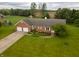 Beautiful brick home with an attached two-car garage and meticulously maintained lawn at 2708 N Buck Creek Rd, Greenfield, IN 46140