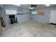 Ample garage space with storage shelving, providing plenty of room for parking and organization at 2708 N Buck Creek Rd, Greenfield, IN 46140