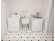Laundry room with a washer, dryer, utility sink, and tiled floors at 2708 N Buck Creek Rd, Greenfield, IN 46140