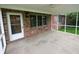 The exterior of this home features a screened porch to extend the living space and enjoy nature at 2708 N Buck Creek Rd, Greenfield, IN 46140
