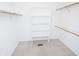 A well-organized walk-in closet featuring shelving and clothes rods, providing ample storage space at 2708 N Buck Creek Rd, Greenfield, IN 46140