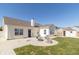 A spacious backyard featuring a concrete patio with outdoor seating and a storage shed at 2761 Winding Creek Ln, Greenfield, IN 46140
