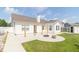 View of the home's backyard with a large patio, lush lawn and storage shed at 2761 Winding Creek Ln, Greenfield, IN 46140