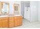 Bright bathroom featuring a double vanity and a shower with white shower curtain at 2761 Winding Creek Ln, Greenfield, IN 46140