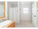 Bathroom featuring a single sink vanity, shower with curtain, and tiled floor at 2761 Winding Creek Ln, Greenfield, IN 46140