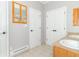 Bathroom with tile flooring, double doors, a toilet, and double sinks in wood vanities at 2761 Winding Creek Ln, Greenfield, IN 46140