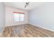 Bedroom highlighting wood floors and large window, perfect for relaxing and unwinding at 2761 Winding Creek Ln, Greenfield, IN 46140