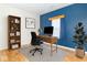 Well-lit bedroom featuring a modern desk setup, wood flooring, and a bright, contemporary style at 2761 Winding Creek Ln, Greenfield, IN 46140