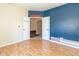 Bedroom featuring beautiful wood flooring and an open doorway to another room at 2761 Winding Creek Ln, Greenfield, IN 46140