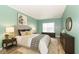 Cozy bedroom with stylish decor, bedside tables, and hardwood floors at 2761 Winding Creek Ln, Greenfield, IN 46140