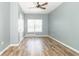 Bright bedroom with wood-look flooring and a large window providing ample natural light at 2761 Winding Creek Ln, Greenfield, IN 46140