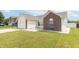 Charming home featuring vinyl siding, brick accents, and a well-manicured lawn at 2761 Winding Creek Ln, Greenfield, IN 46140