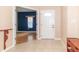 Bright foyer with tile flooring and an open view to a living space with hardwood floors at 2761 Winding Creek Ln, Greenfield, IN 46140