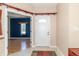 Bright foyer featuring a white front door and view into the living area at 2761 Winding Creek Ln, Greenfield, IN 46140