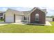Charming single-Gathering home with a well-maintained lawn, brick accents, and a two-car garage at 2761 Winding Creek Ln, Greenfield, IN 46140