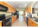 A kitchen features cabinets and views into another room, offering ample space and natural light at 2761 Winding Creek Ln, Greenfield, IN 46140