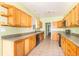 Bright kitchen with plenty of wood cabinets, a sink, and modern appliances with neutral walls at 2761 Winding Creek Ln, Greenfield, IN 46140