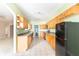 Spacious kitchen featuring wooden cabinets, modern appliances, and tile floor at 2761 Winding Creek Ln, Greenfield, IN 46140