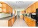 Spacious kitchen with wooden cabinets and stainless steel appliances at 2761 Winding Creek Ln, Greenfield, IN 46140