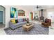 Staged living room with tile floor and stylish furniture, with fireplace and an open layout at 2761 Winding Creek Ln, Greenfield, IN 46140